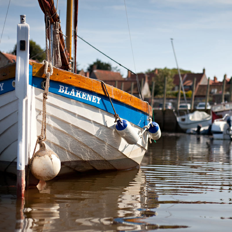 Wooden crab boat moored against the Quay