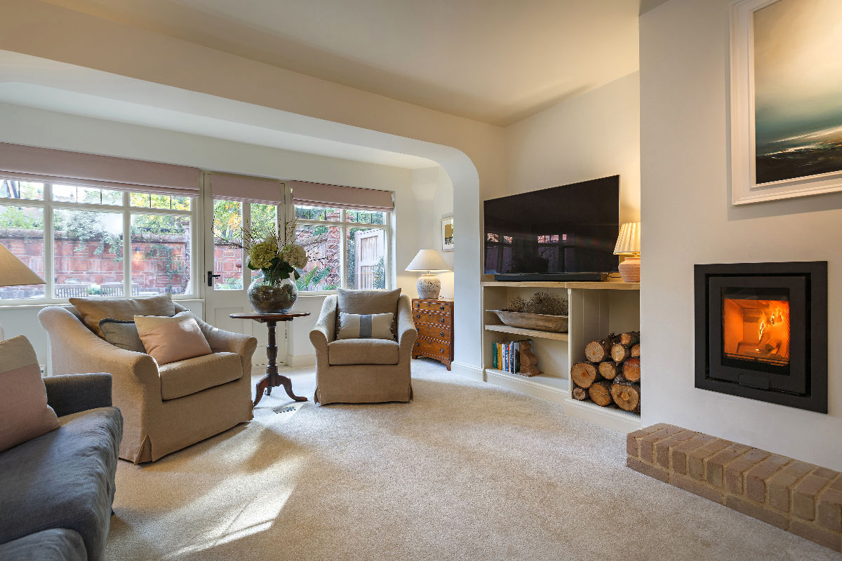 The Curlews sitting room with log burner