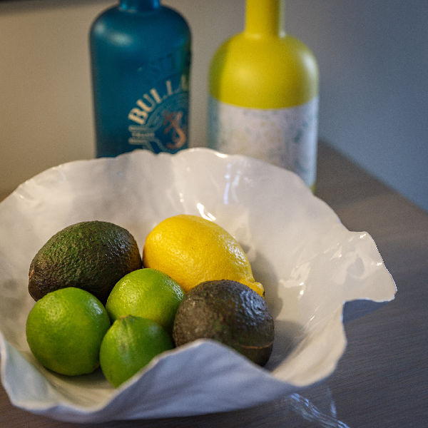 Norfolk Gins and fruit with advocadoes in a bowl